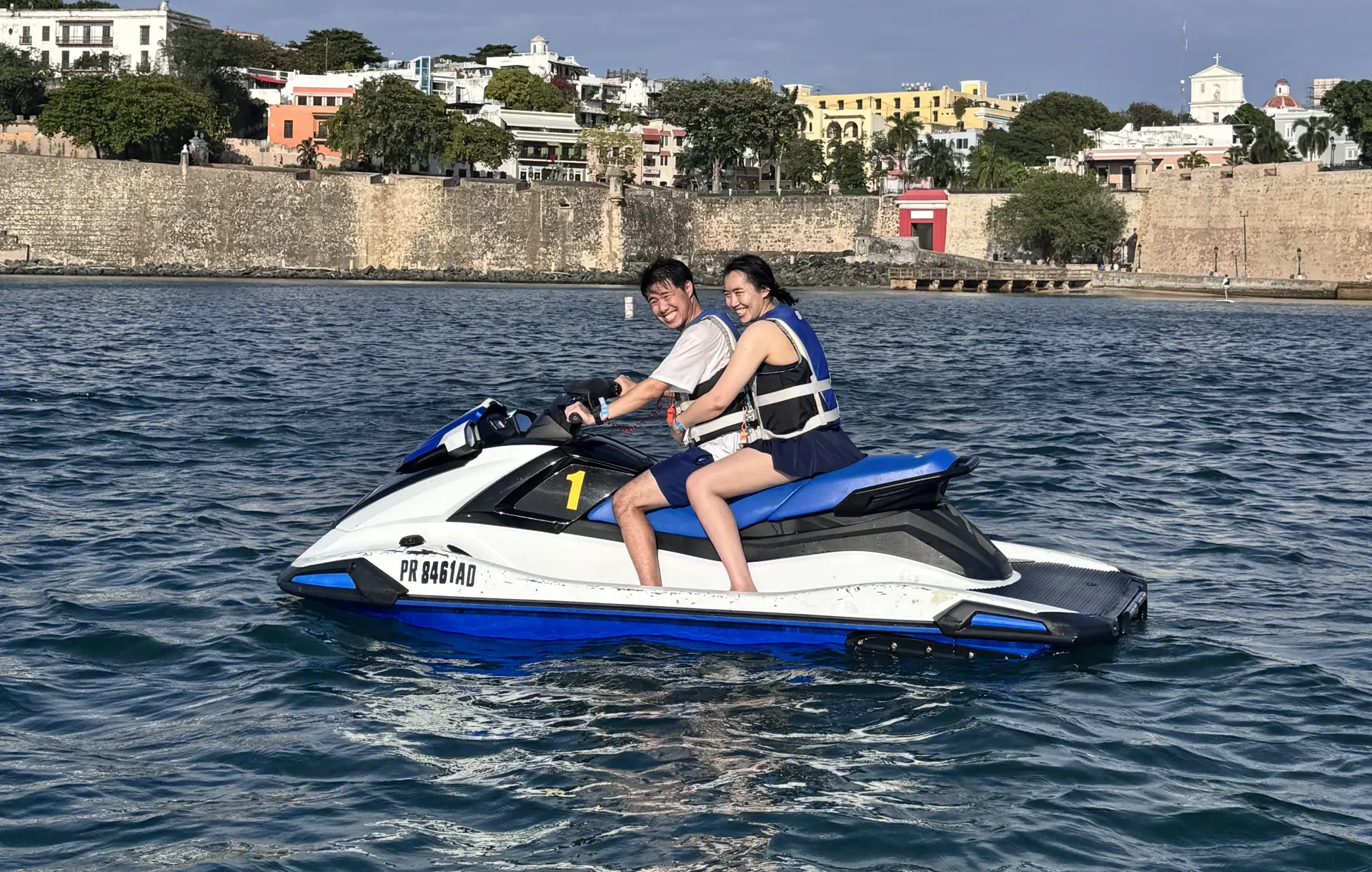 Technicians servicing an outdoor AC unit