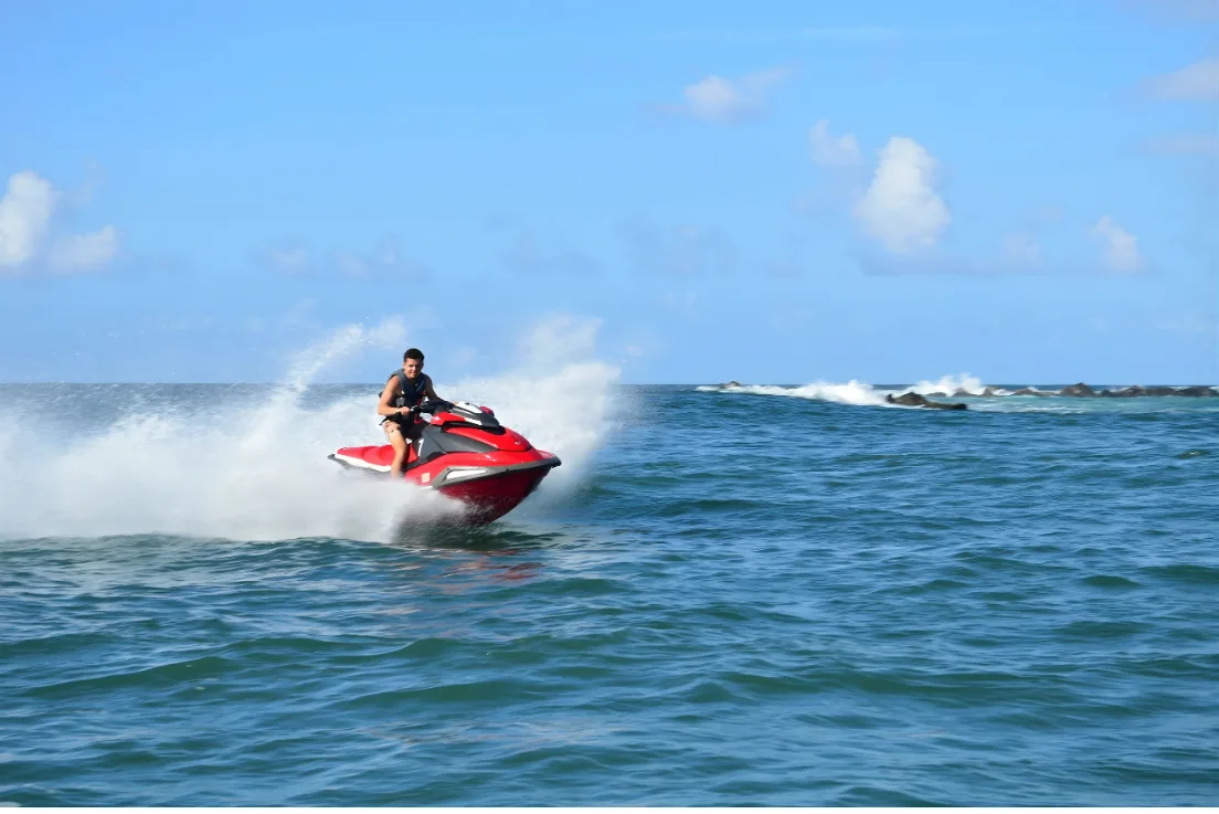Rider on a brand-new Yamaha VX Deluxe WaveRunner on open water near Pine Grove Beach, Puerto Rico