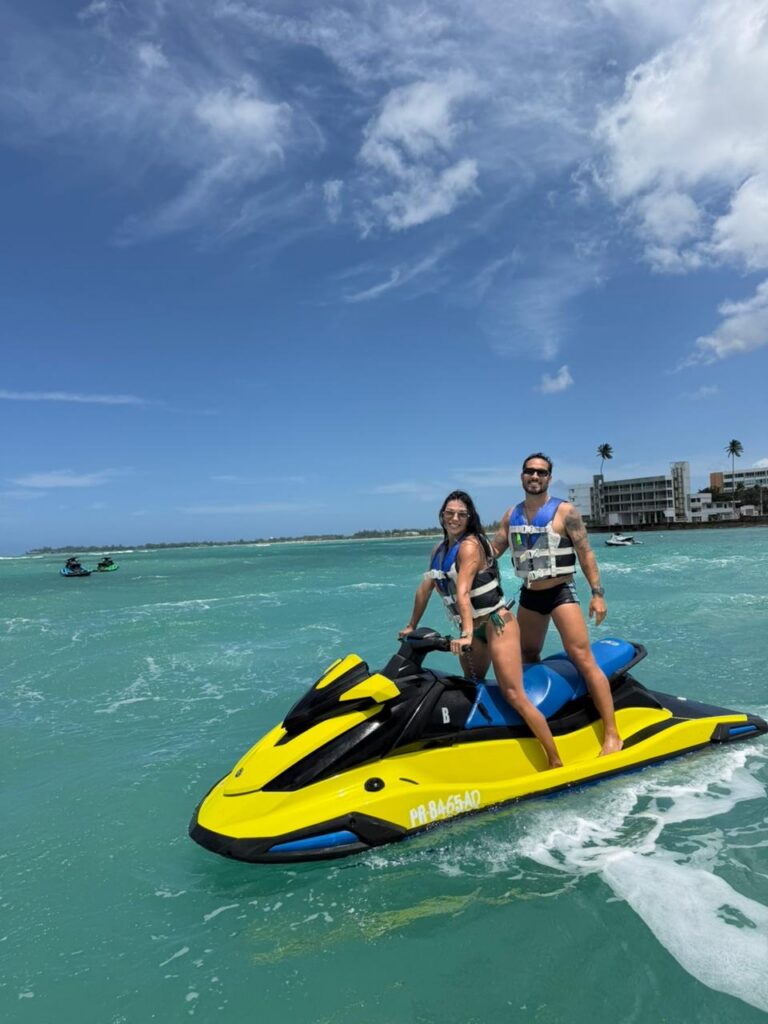 Couple on a jet ski rental at Isla Verde Beach, Puerto Rico