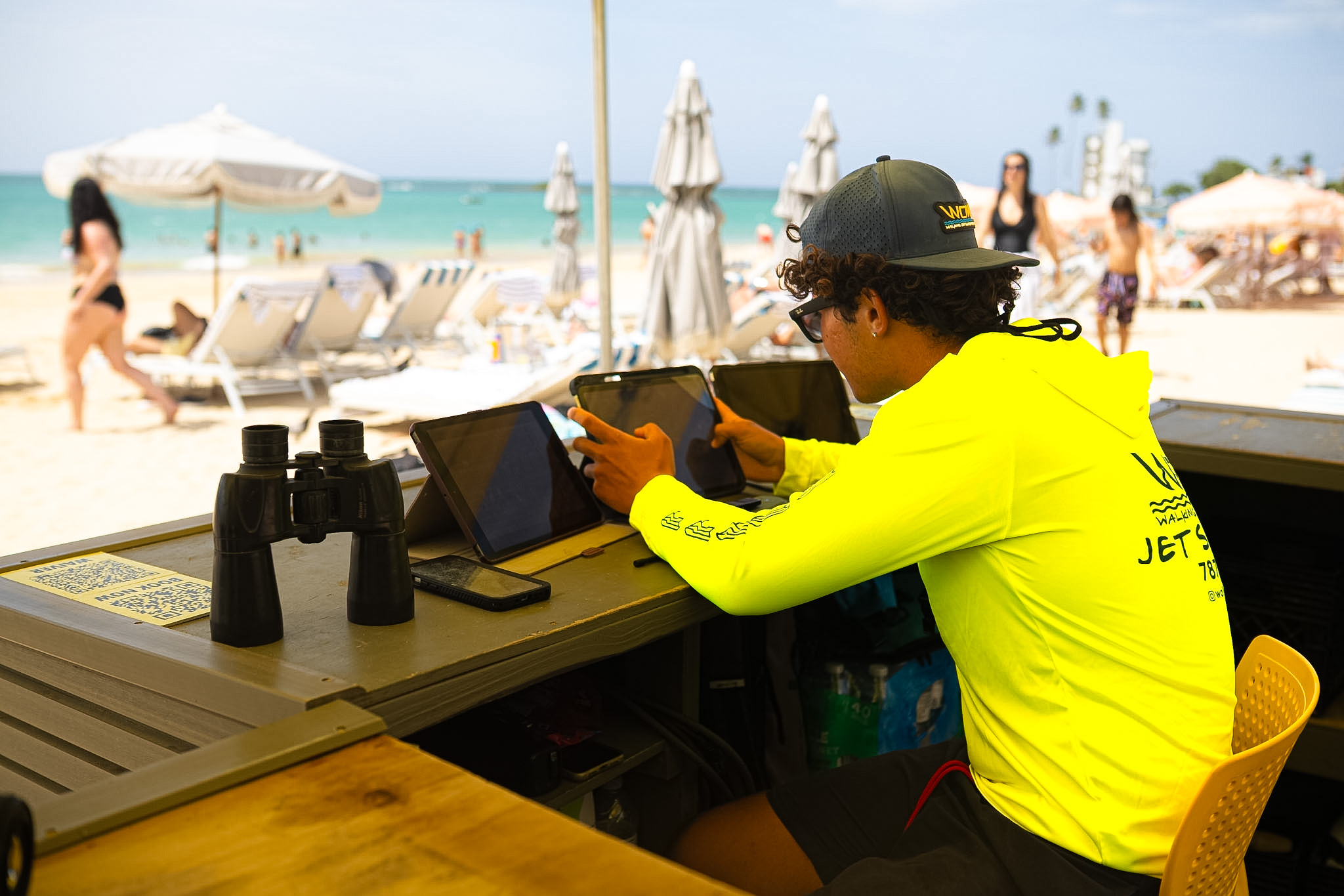 WOW team member checking in riders at the Isla Verde beach counter