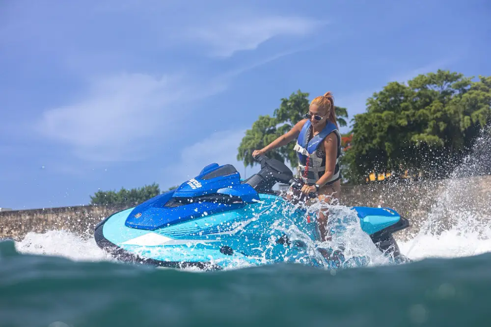 Jet ski splashing past the Old San Juan city wall on a WOW tour